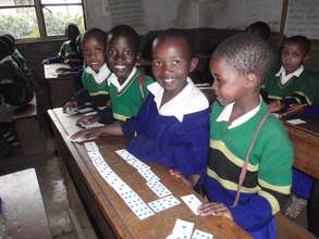 Recognising numbers using dominoes.