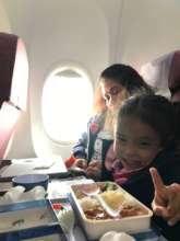 Brielle on plane ride to Taiwan