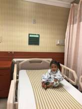 Brielle in hospital bed pre-surgery tests