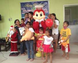 Happy toy recipients with Jolly Bee mascot