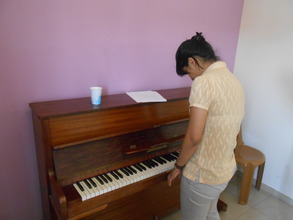 Manmeet getting some piano lessons