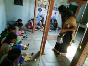 Serving lunch by our Vice President to children