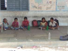 Migrated families Kids having mid day meal