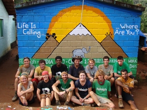 Raleigh group in front of a completed house