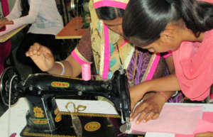 Girls learning to make Designer Bags