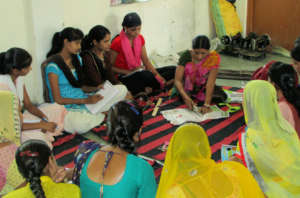 Girls learning to make Designer Bags