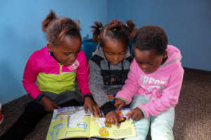Children enjoying the reading center
