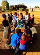 Children scrambling for the motionless car