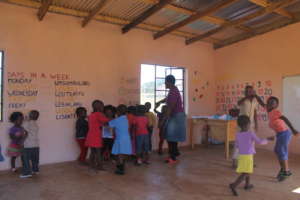 Teacher Mbali dancing with the children