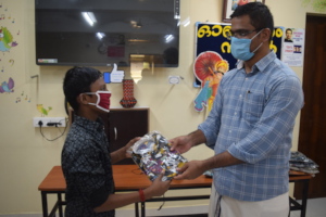 Our director distributing new clothes for children