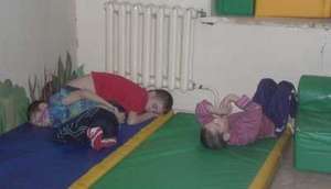 Children sleeping on mats