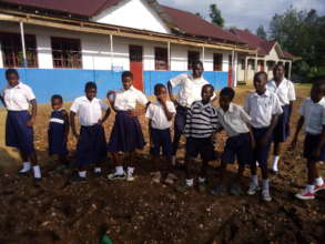 Children happy to show their new school building