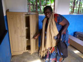 Rose admires a new cupboard