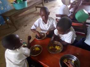 Pupils enjoying a free, nutritious school meal