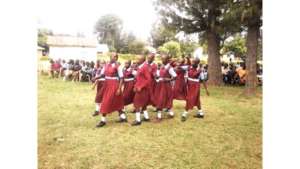 Girls performing for their community