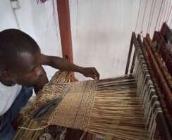Mario weaving on 8 paddle loom