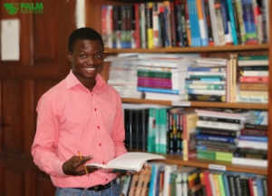 Mahamadu volunteering as a Librarian