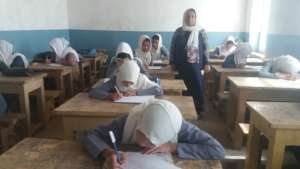 Girls taking final exams at Mullah Karim