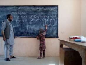 A young girl at the chalk board at Besh Kappa