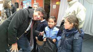 Local officials with students