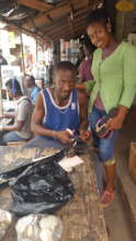 Mercy and her uncle in his shop.