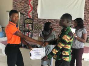 Gifty Receiving her Teen Girls Club Certificate