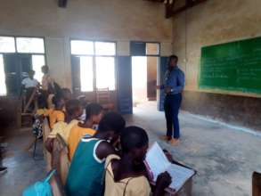 Headmaster Ernest working with the Teen Girls Club
