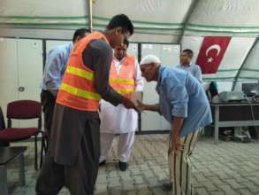CHCS team distributing cash in a Refugee camp