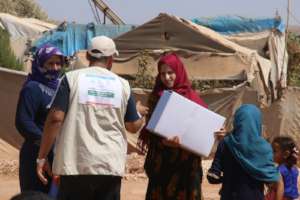 The girls in Refugees camp receiving relief goods