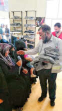 Cloth distribution among Syrian women