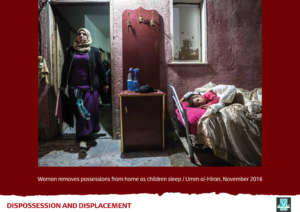 Child sleeps as mother prepares for demolition