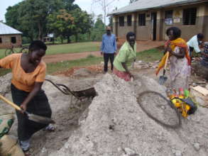 Women prepare Motar for Water Tank Construction
