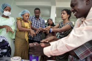 Dr. Brenda training her team, photo by D. Telemans