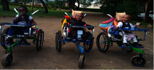 Children supported with wheelchairs in Moshi.