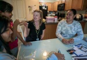 IRC caseworker meets with an asylum seeking family