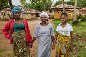 Midwife with her community members