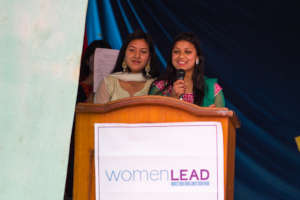 Manisha giving a speech at SLP Graduation Ceremony