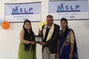 Sajju (left) thanks the Bluebird School principal