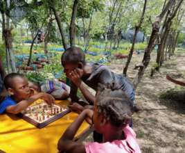 Bernard, a top SAKALA student, teaches chess