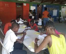 Students taking exam for SAKALA's Ekselans program