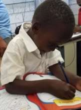 Student at SAKALA learning to write