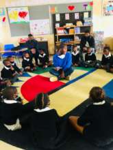 Reading circle at Sobambisana Primary School