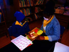 One-on-one reading at Diepsloot Combined School