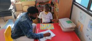 One-on-one reading at Diepsloot Primary School