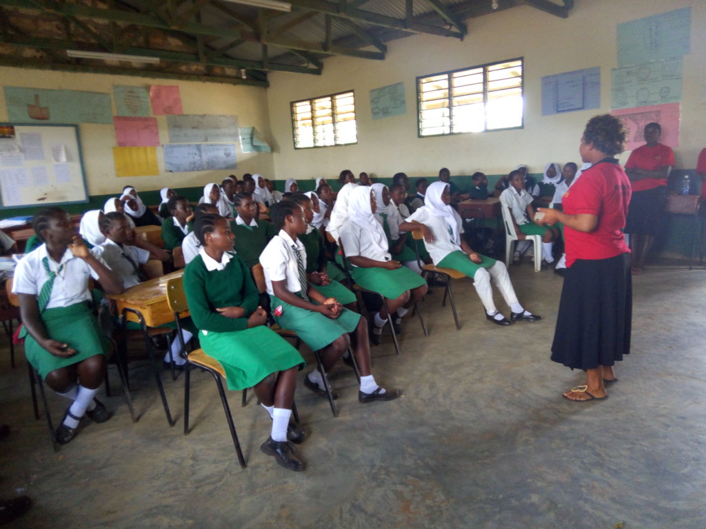 Clemence addresses the girls at the conference