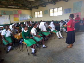 Clemence addresses the girls at the conference