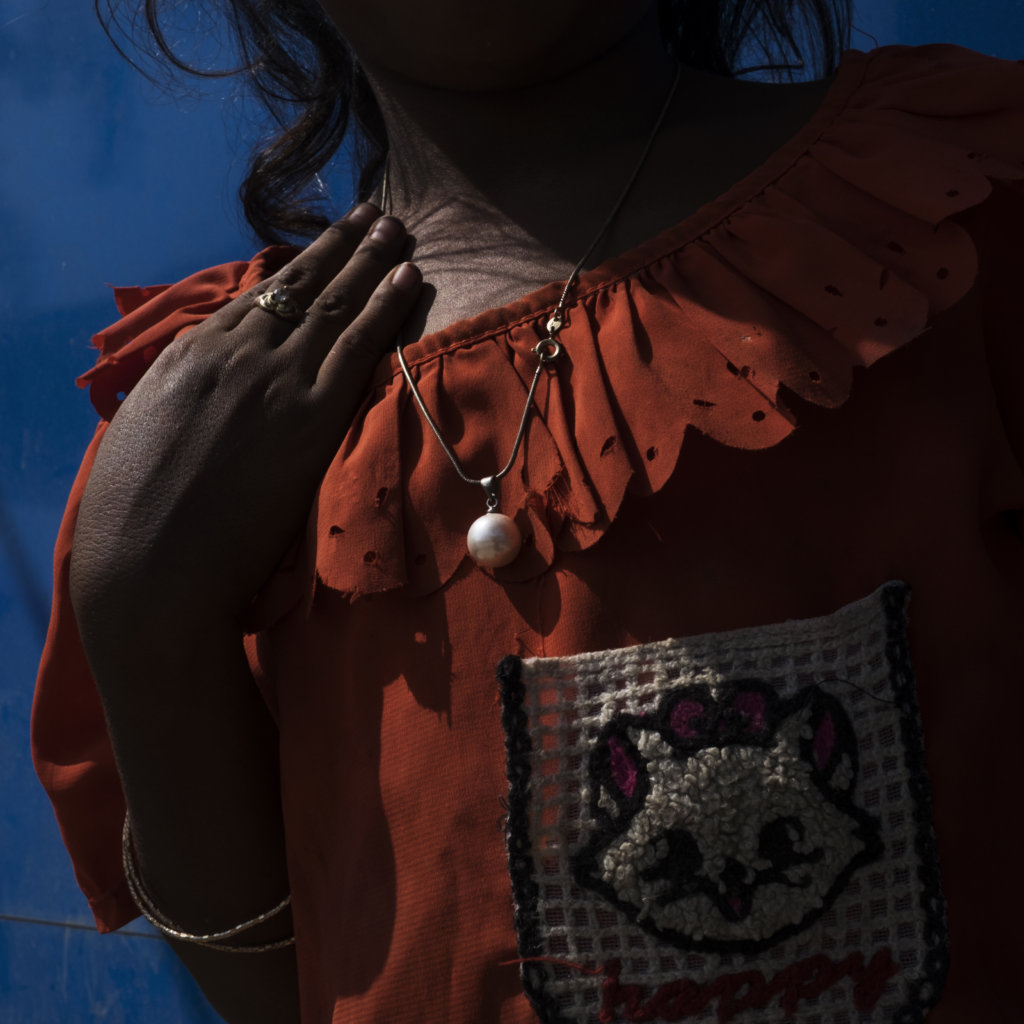 A 9-year old Cambodian girl dressed as an adult