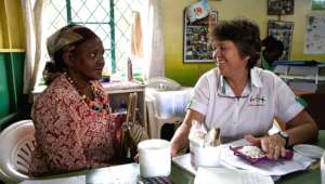 Melanie Blake MBE with a patient