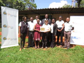The team receives a plaque from GA Insurance