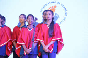 Malini in the ACT Choir during Annual Day